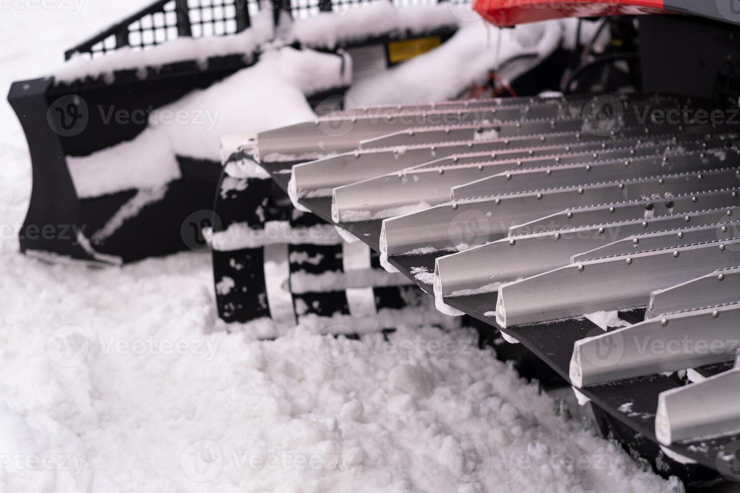 Metal tracks of a snowplow car in winter in the snow photo