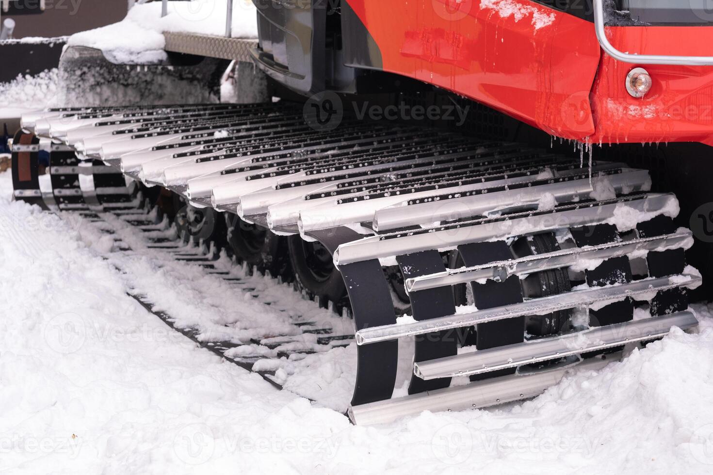 Metal tracks of a snowplow car in winter in the snow photo