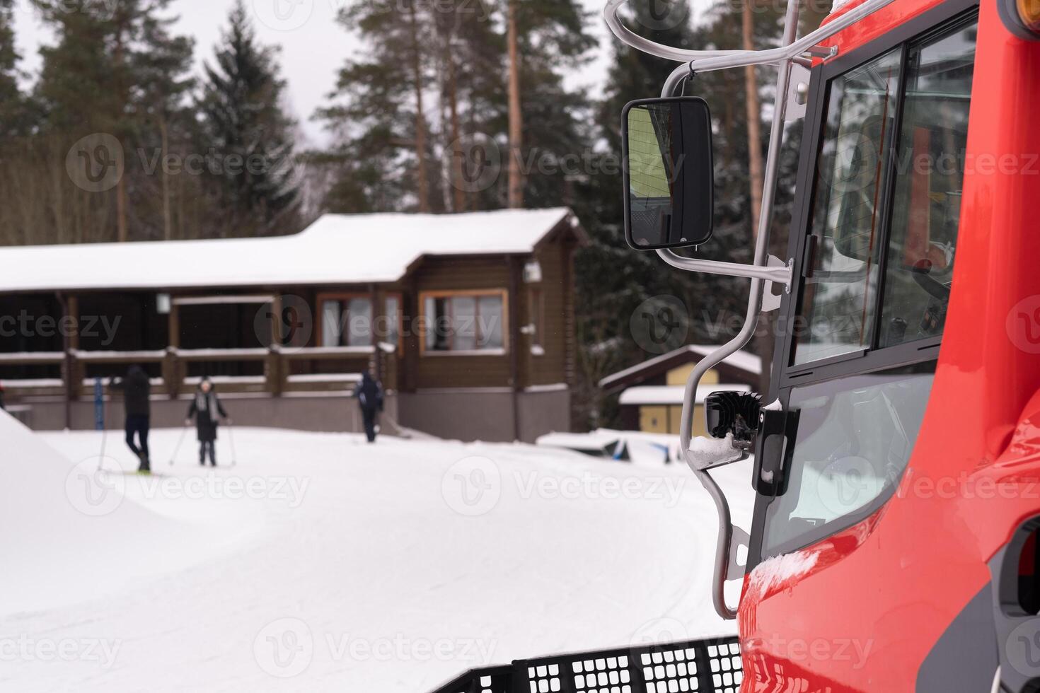 The cabin of a snowplow on tracks, standing in the forest in winter photo