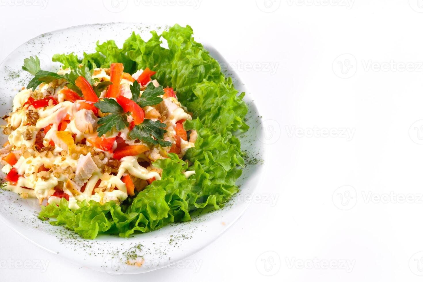 Salad trends. Salad with ham, paprika, pepper and cheese on a white isolated background photo