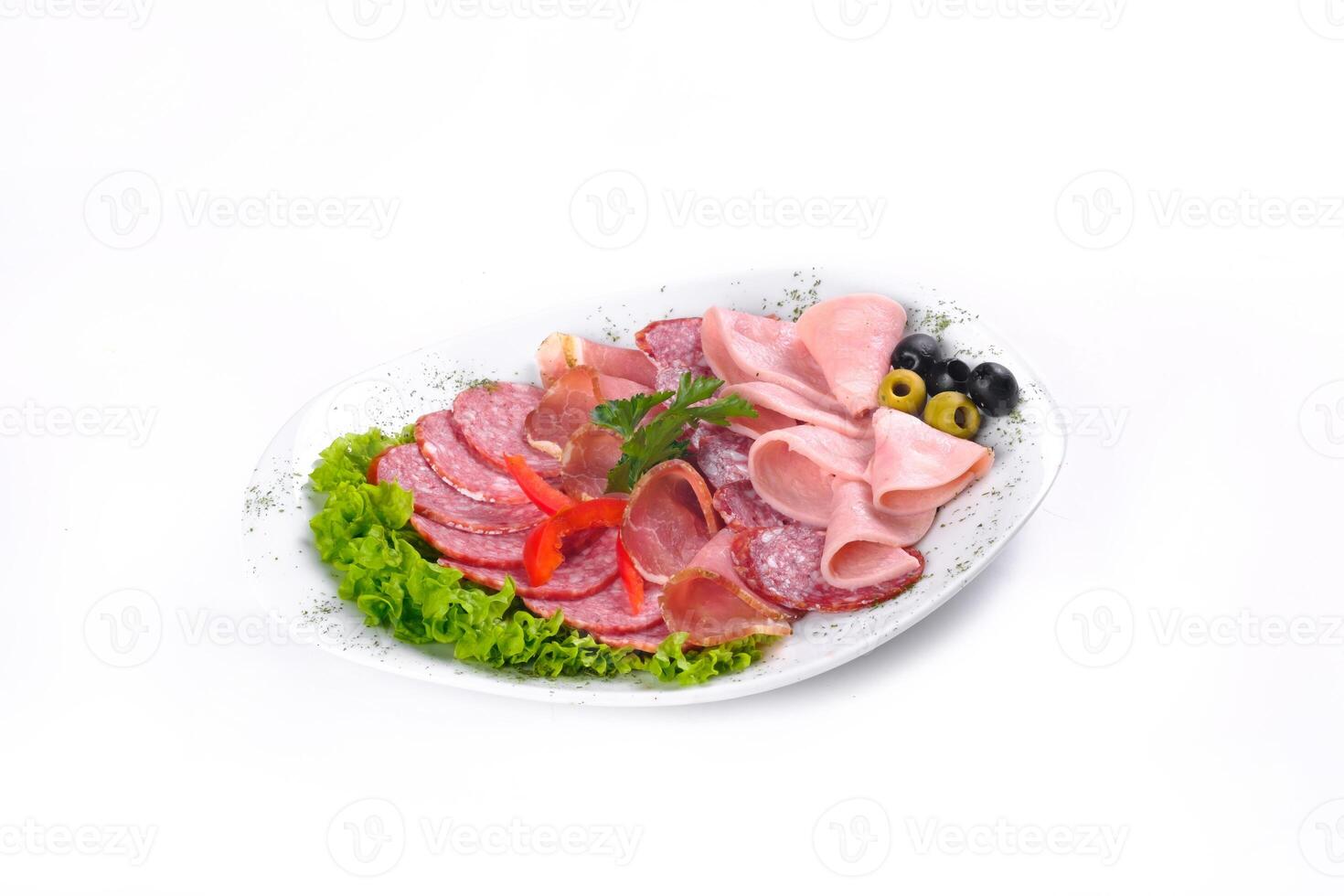 Ham and sausage cut into slices on a plate on a white isolated background photo