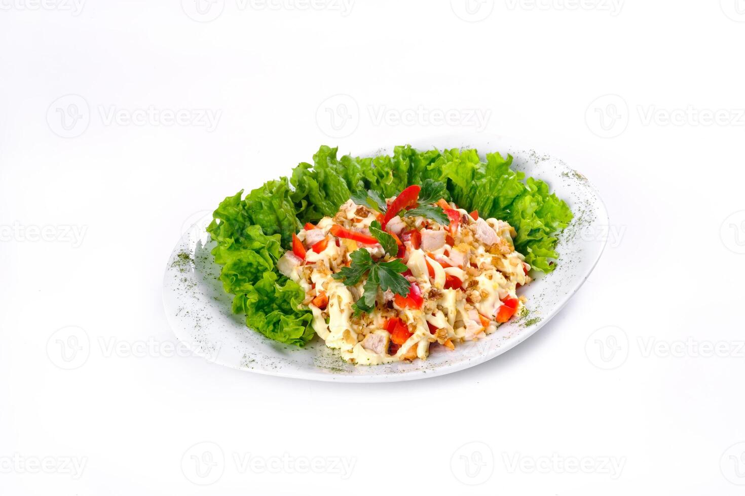 Salad trends. Salad with ham, paprika, pepper and cheese on a white isolated background photo