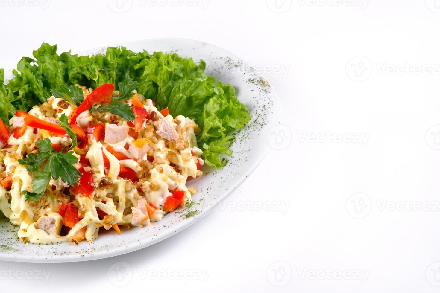 Salad trends. Salad with ham, paprika, pepper and cheese on a white isolated background photo