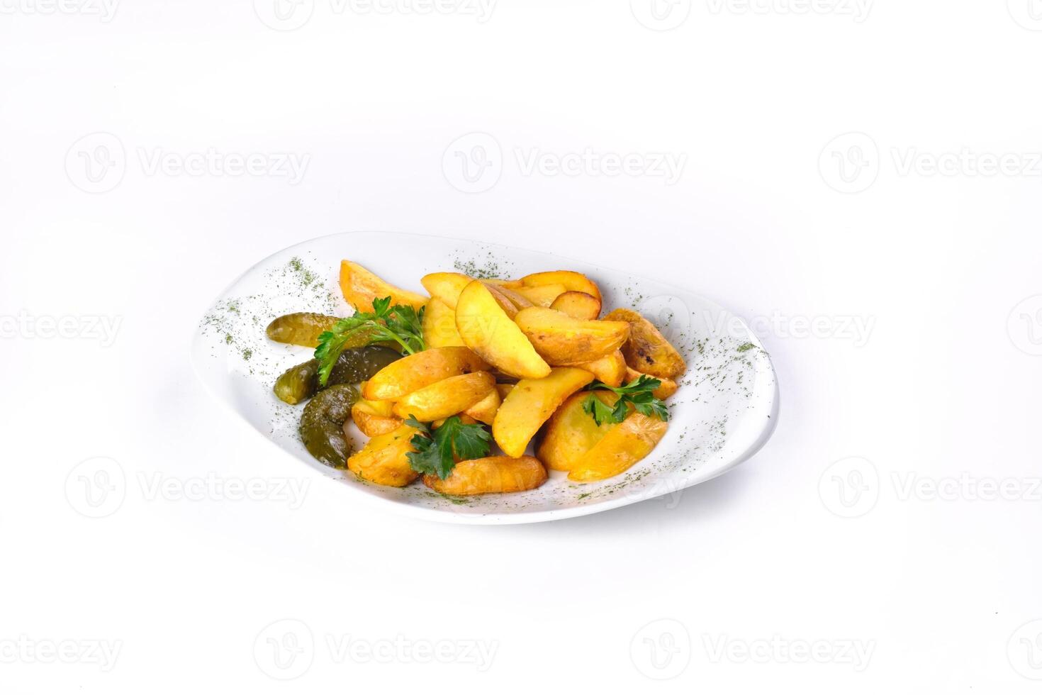 Fried potato slices on a white plate pickled with cucumber, isolated on a white background photo