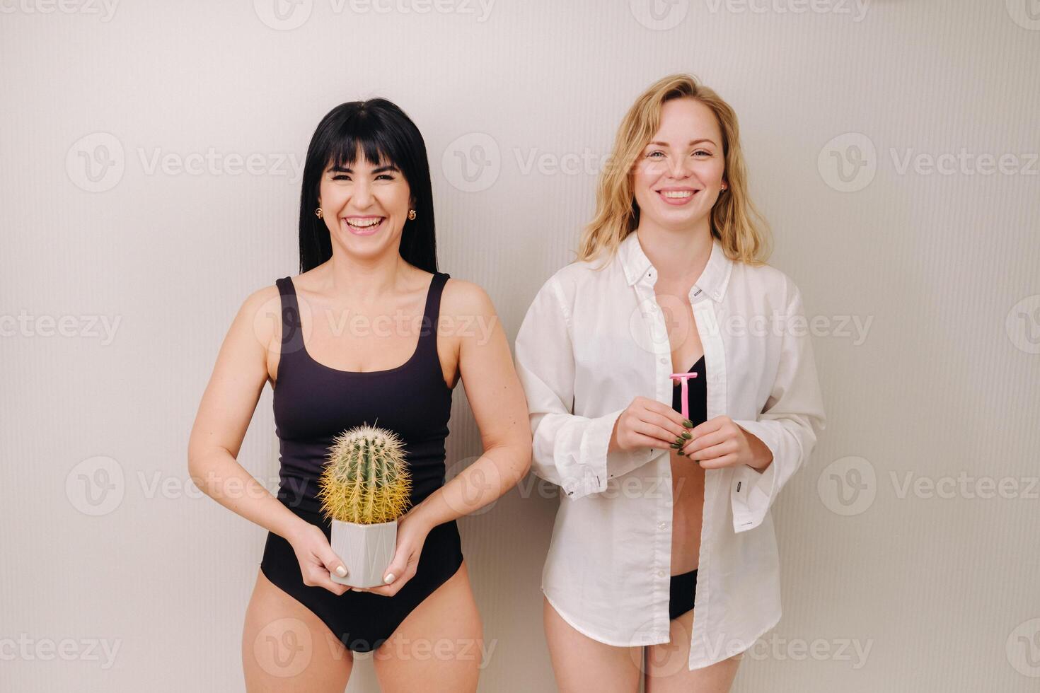 Cactus concept. Unshaven body . One girl is holding a cactus in her hands, and the second girl is holding a razor. Symbol of unshaven body parts photo