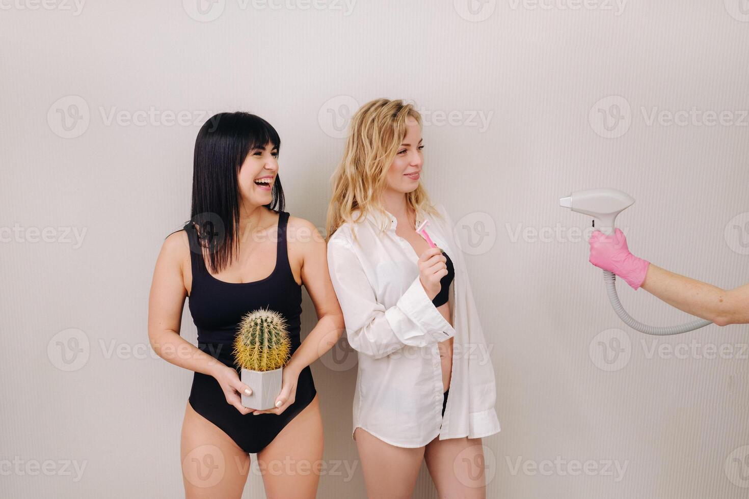 Cactus concept. Unshaven body . One girl is holding a cactus in her hands, and the second girl is holding a razor. Symbol of unshaven body parts photo