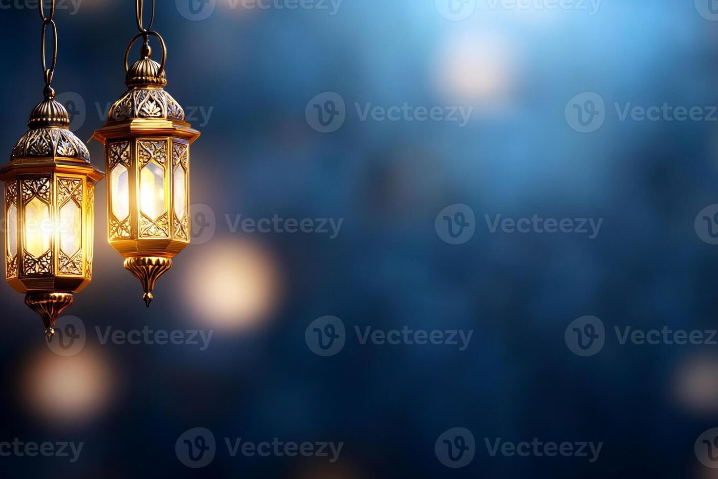 Two lamps hanging from the ceiling in front of a blue background photo