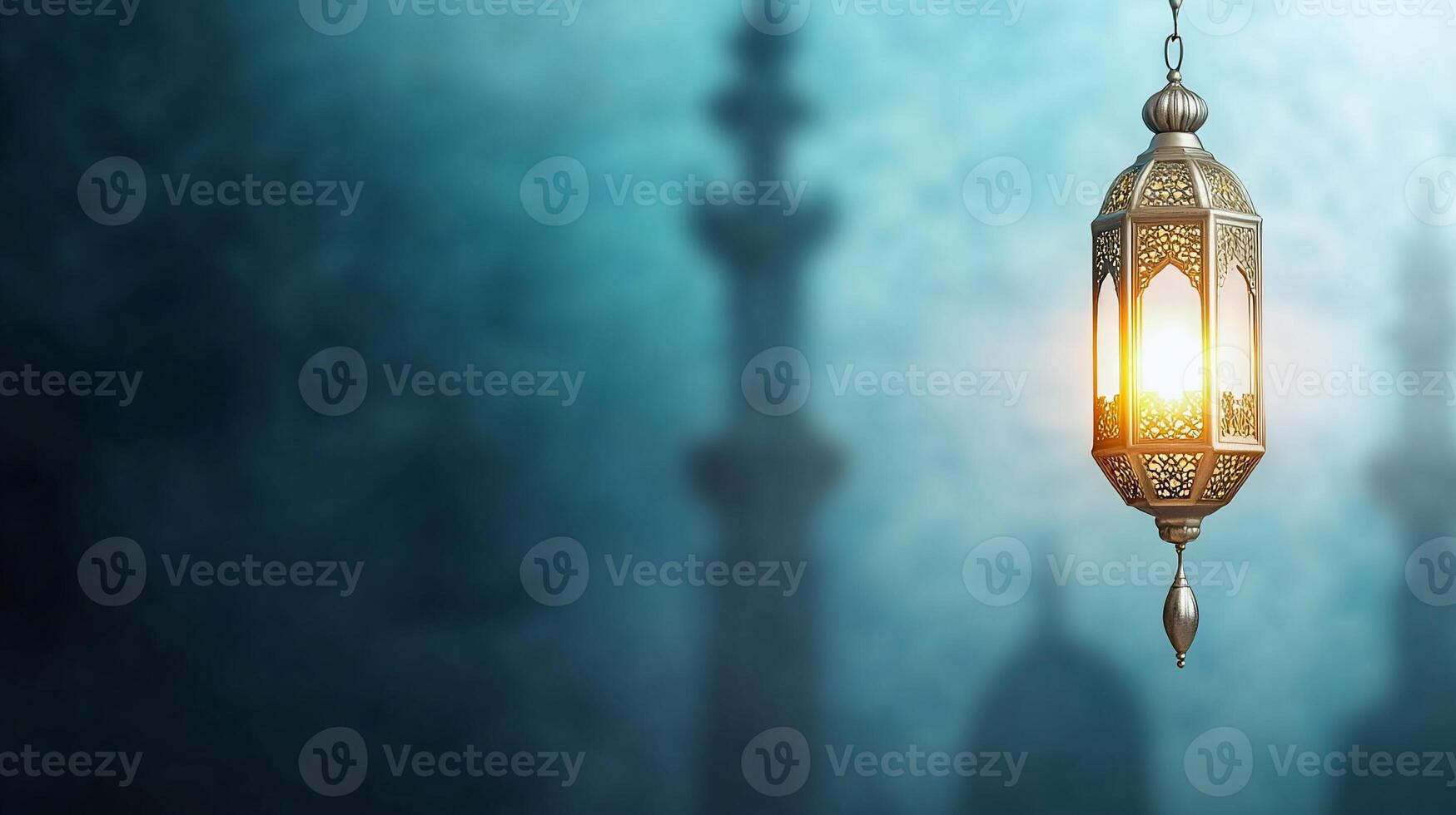 A lamp with a golden design hanging from a mosque photo