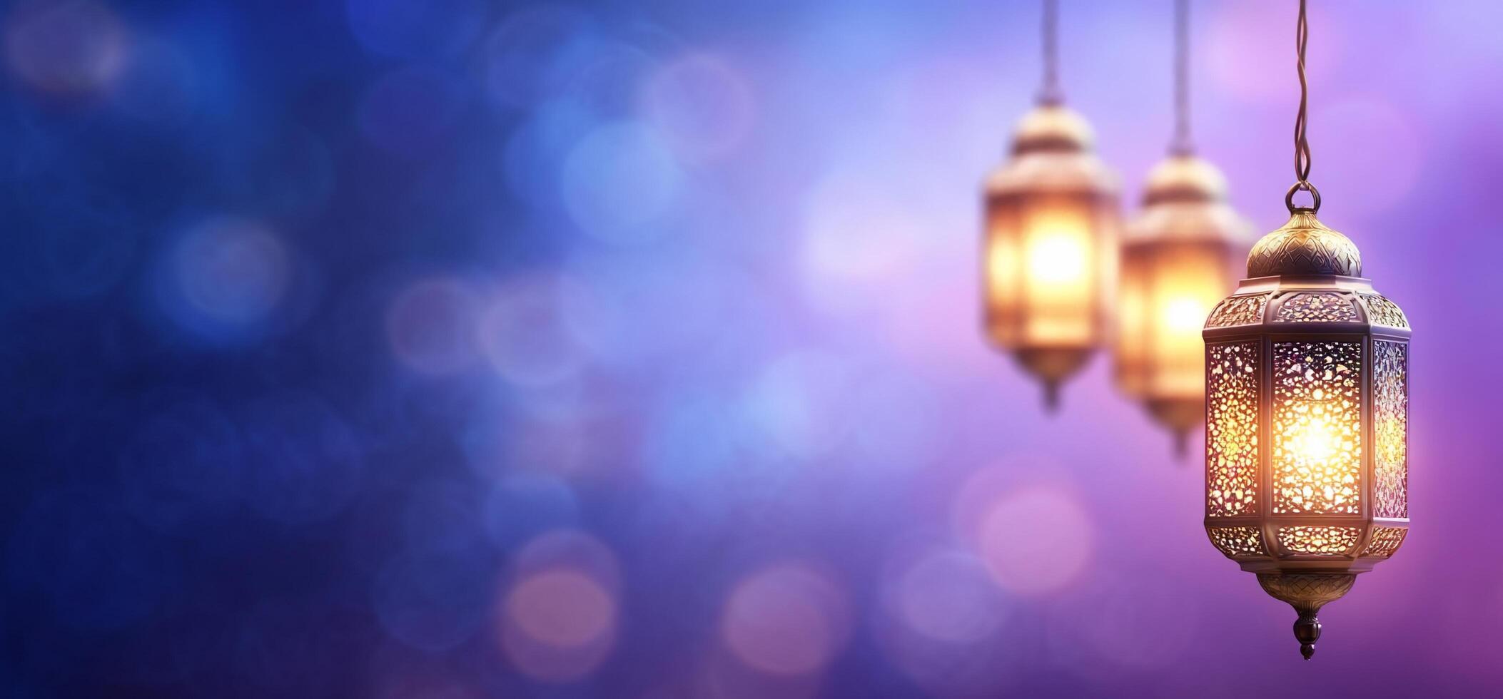 Three lamps hanging from a string on a purple background photo