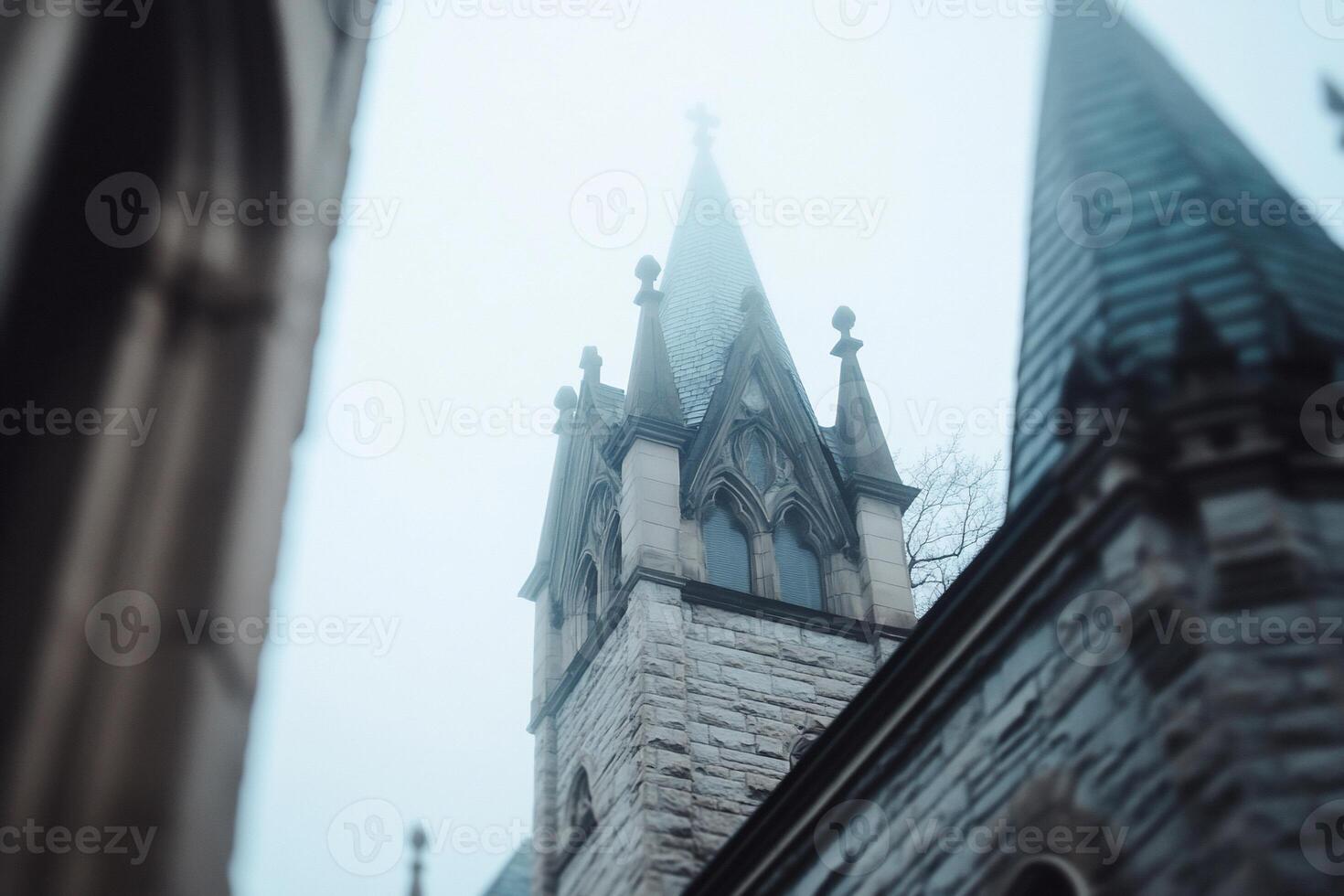 A church steeple in the fog photo