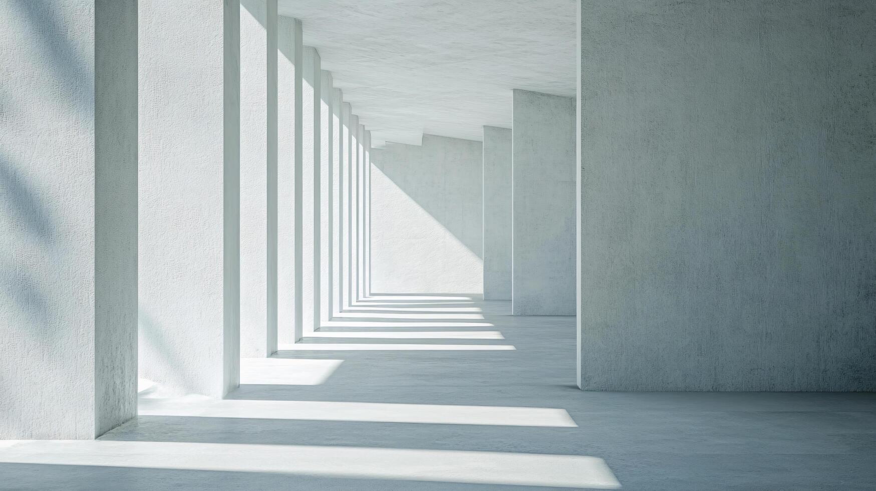 Long, empty hallway with white pillars and a white wall. The light is shining on the wall, creating a sense of emptiness and loneliness photo