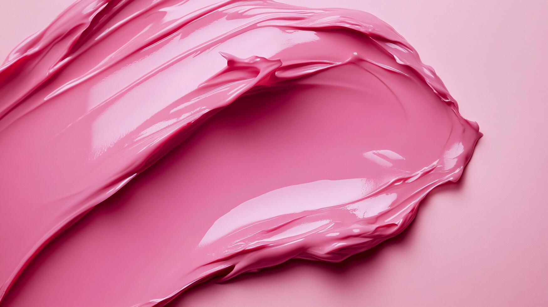 Tube of pink lipstick is displayed on a pink background. The lipstick is in a tube and has a shiny, glossy appearance. The pink color of the lipstick is vibrant and eye-catching photo