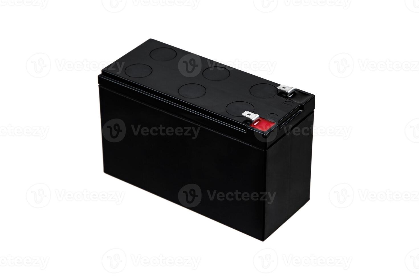 A black sealed lead-acid battery with two terminals, one marked with a red positive sign, isolated on a white background. photo