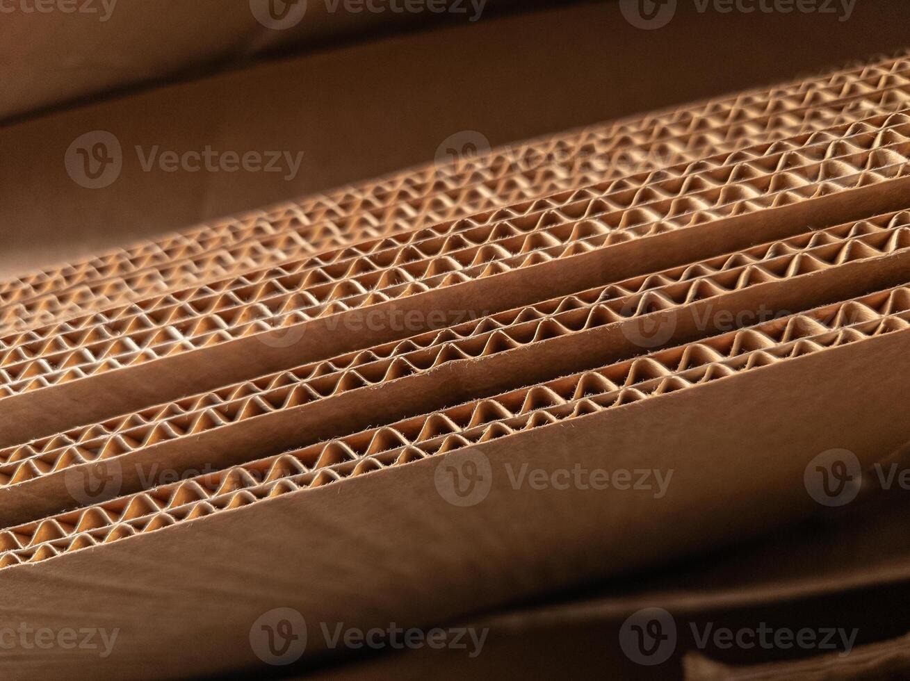 Close-up view of stacked corrugated cardboard layers, showcasing the intricate wave structure and texture, ideal for concepts like packaging, recycling, industry, and material design photo
