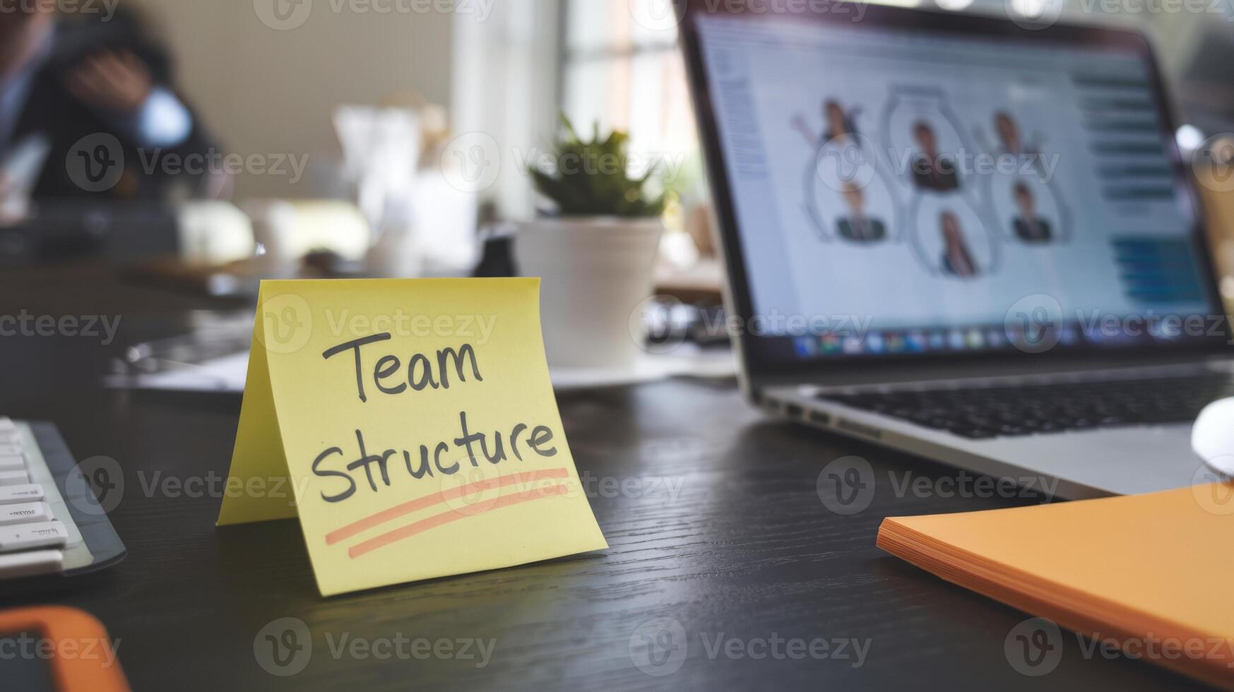Team structure on a sticky note on a desk photo