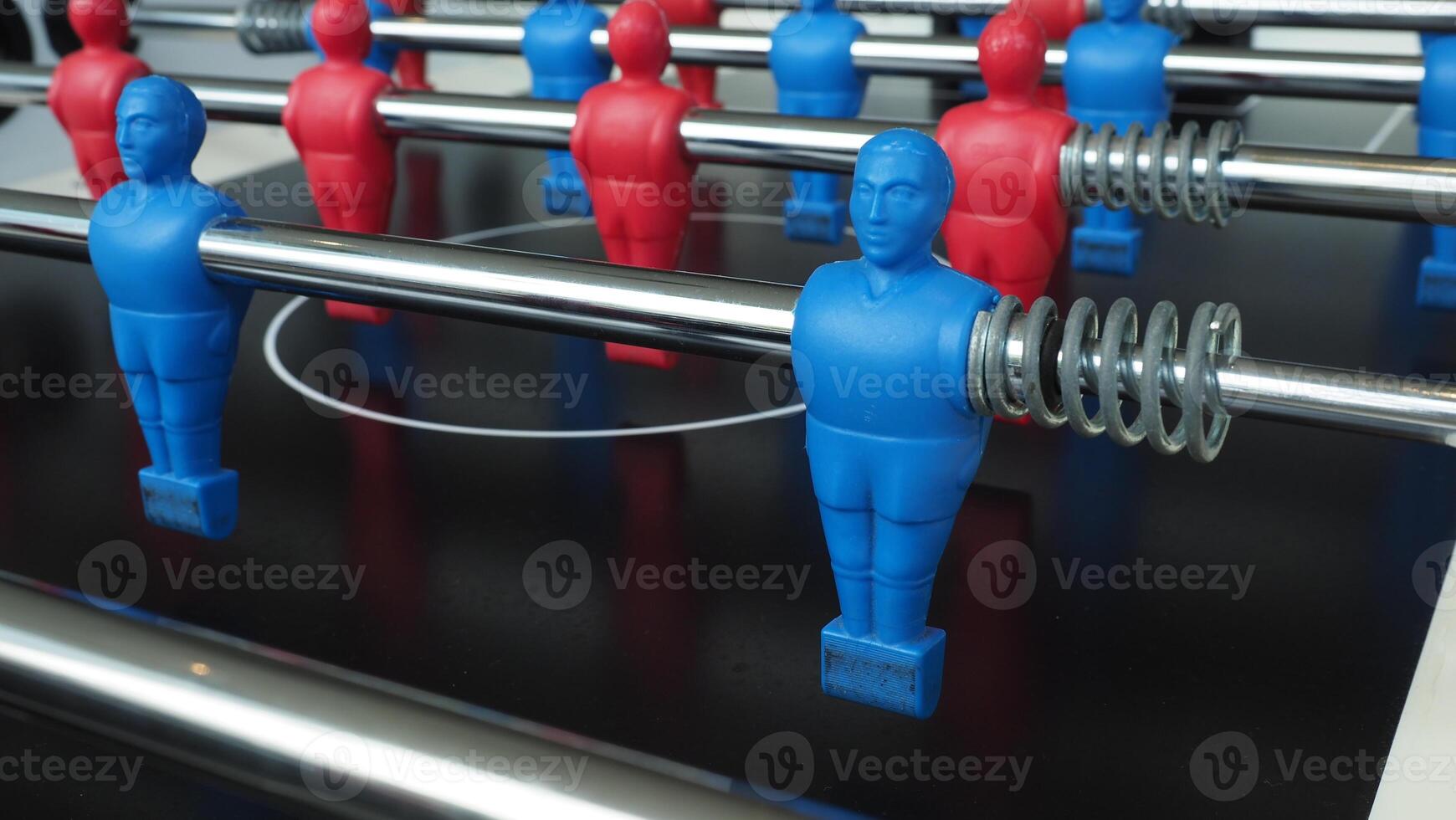Football table or soccer table game with plastic player figurine. Mini Soccer game which famous in past and be collectable item for foosball lover. Play by two hand control each row of player figurine photo