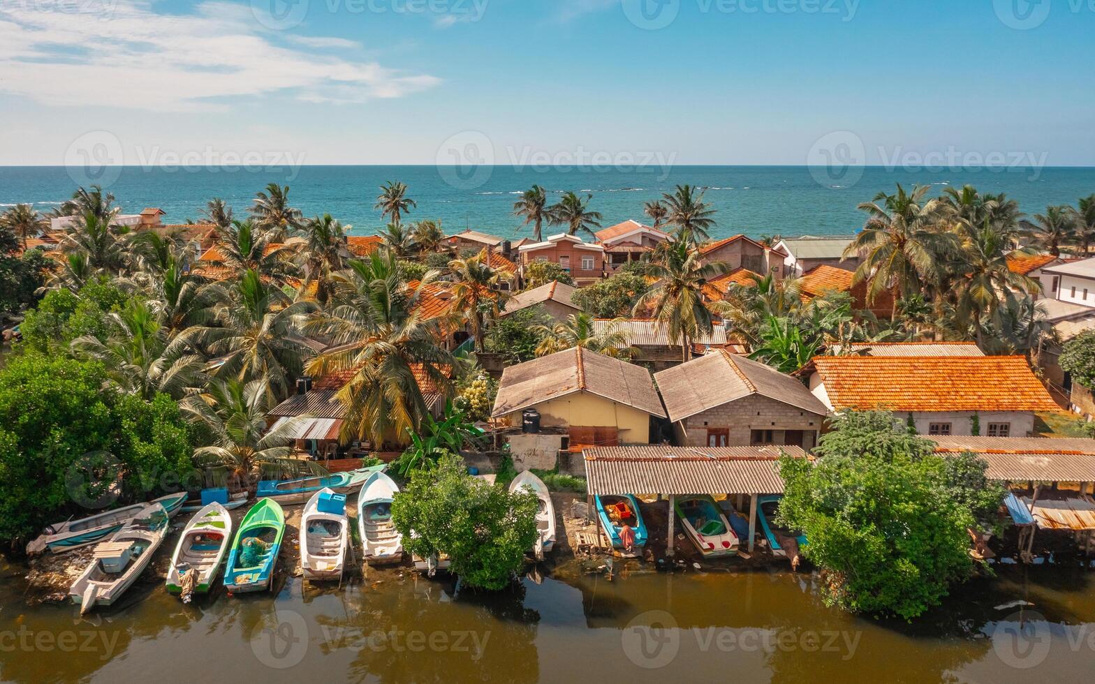 Aerial view of houses on the shoreline in Negombo. Negombo is a city on the west coast of Sri Lanka photo