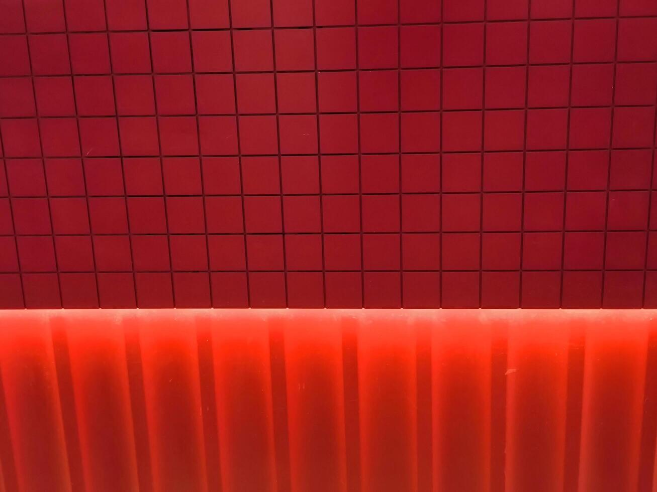 Red concrete wall and Lighting Effect. texture background, Red wall for design art work vintage style. photo