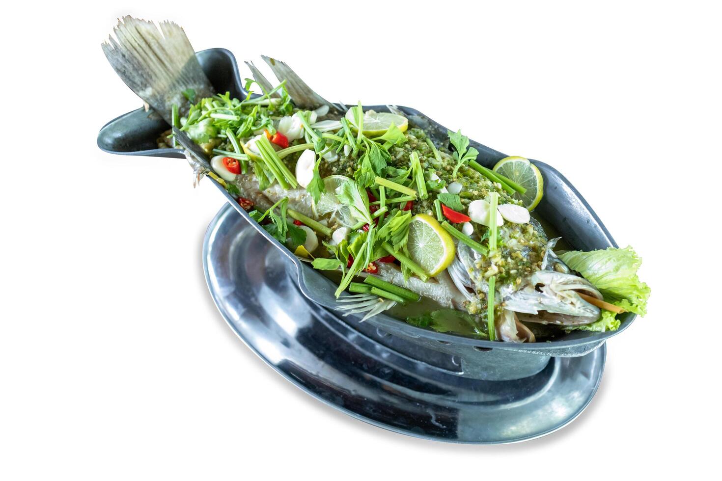 Top view of Steamed Seabass with Lime and Chillies topping with mix vegetable, focus selective photo