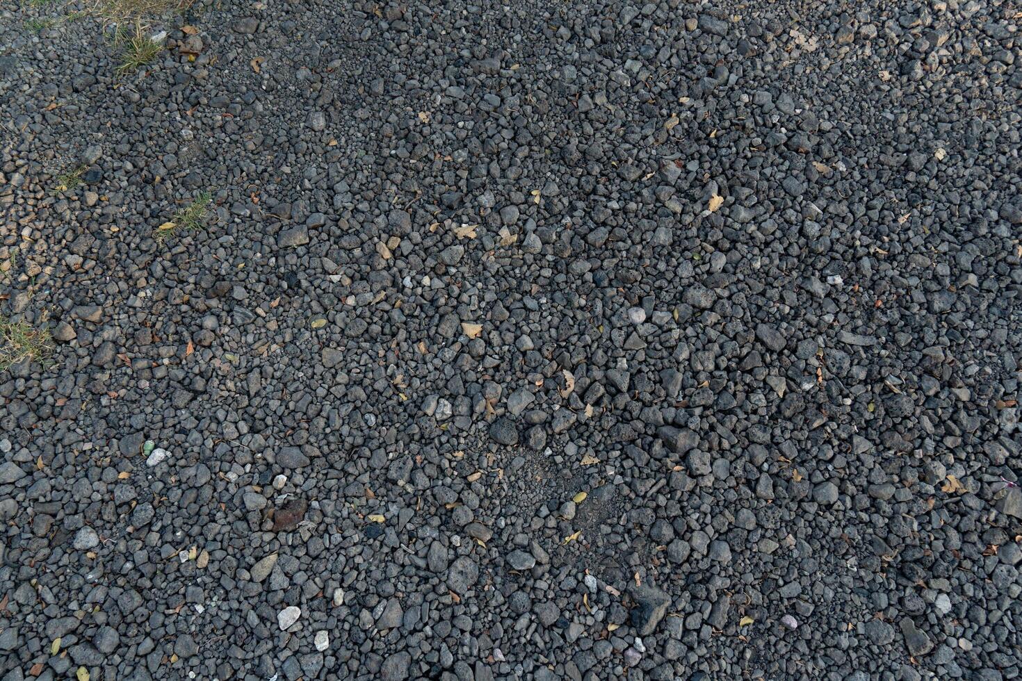 Pile of grey crushed stone. Abstract background and texture for design. photo