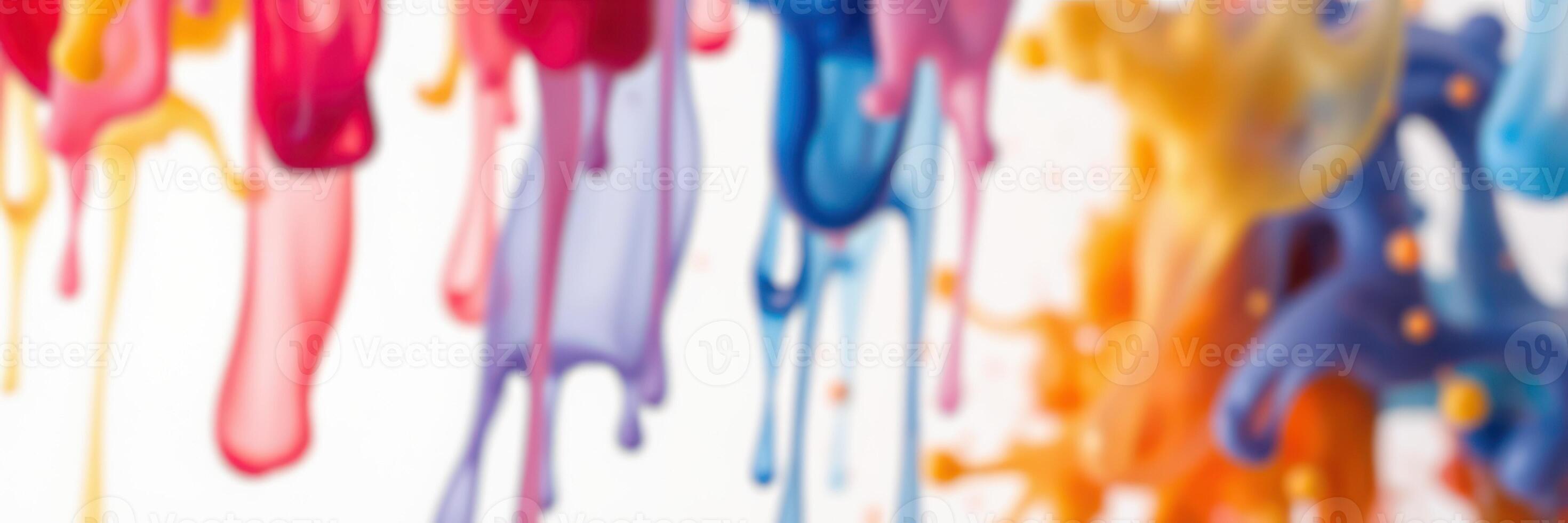 Colorful paint drips on a white background create an artistic abstract design showcasing vibrant hues and creativity photo