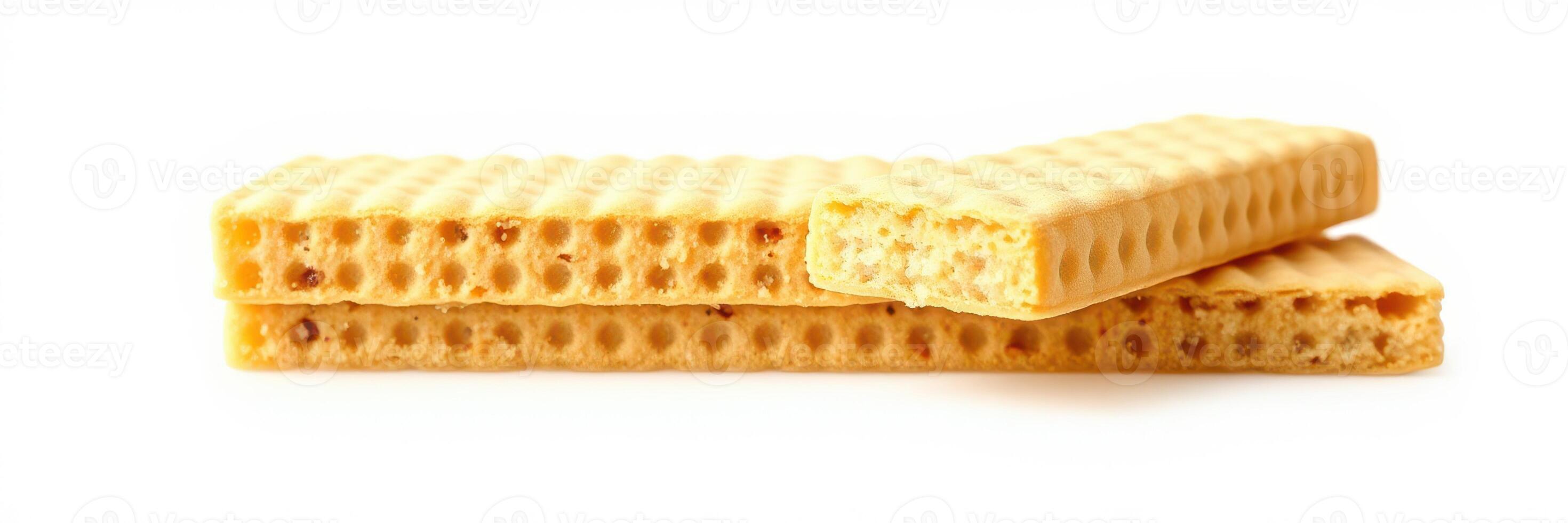 Crunchy wafers stacked on a clean surface with one piece partially bitten during a casual snack time photo