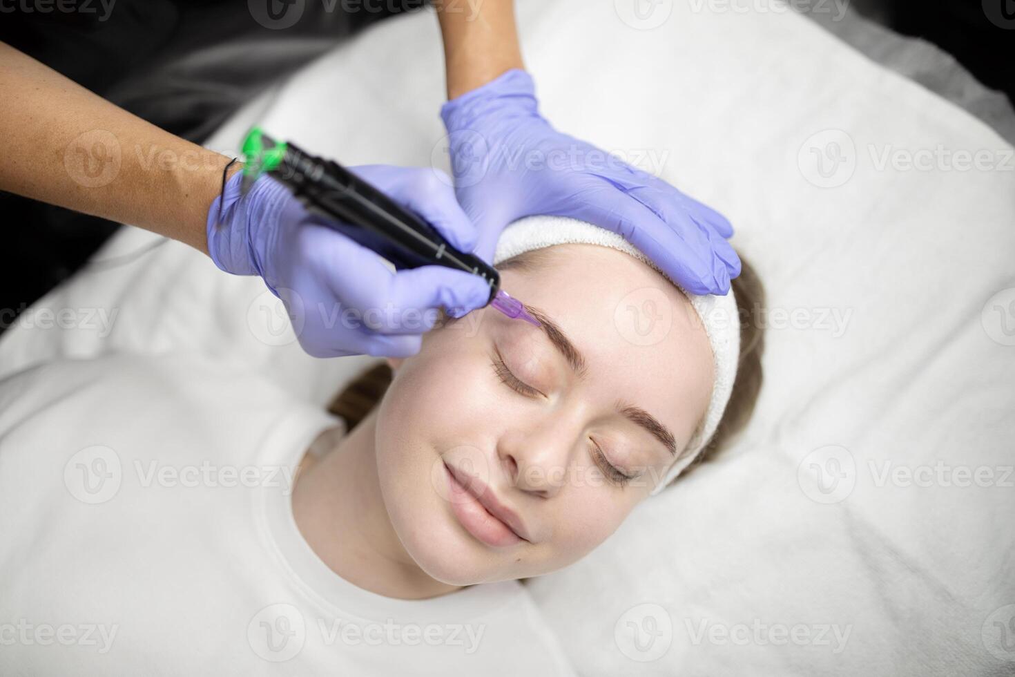 In a cozy beauty salon, woman are undergoing a pampering session for permanent makeup. Trained professionals perform precise application techniques for long-lasting beauty. photo