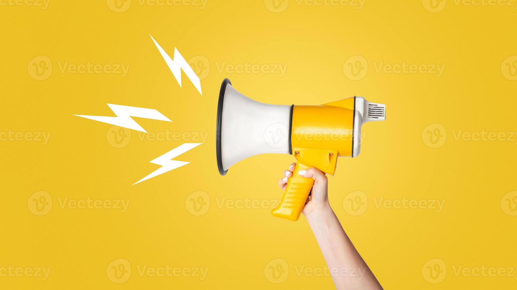 Cropped view of young girl holding megaphone on white background, copy space. Panorama photo