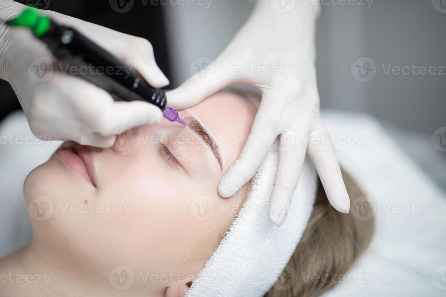 Woman enjoy a pampering session at a beauty salon, receiving a permanent makeup procedure. The artist carefully applies makeup for long-lasting results on their brows. photo