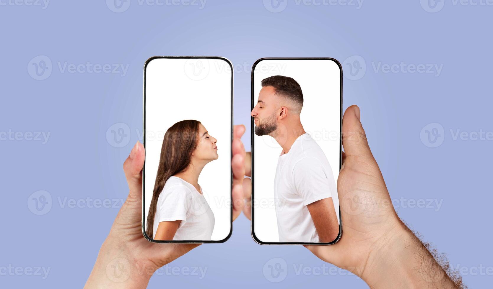 Two hands hold smartphones displaying a couple leaning in for a kiss. This digital collage represents modern love and connection through technology while showcasing genuine affection. photo