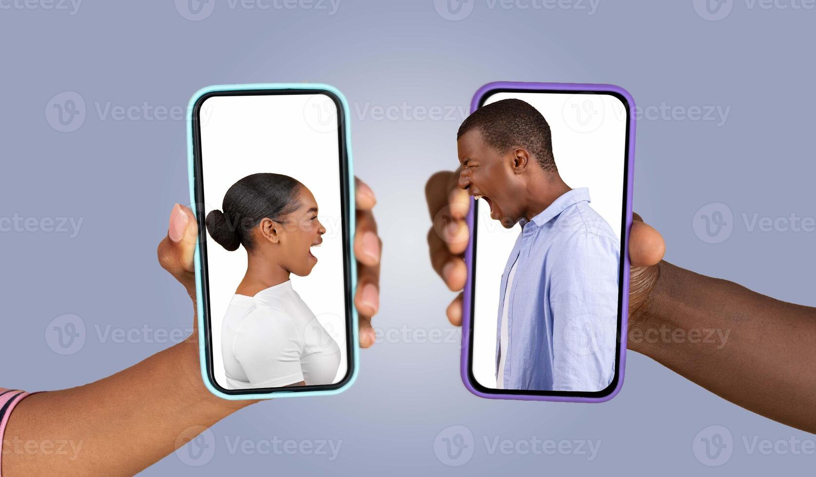 A couple is communicating through their smartphones, expressing strong emotions as they exchange messages. Their hands hold the phones, showing a dynamic chat moment. photo