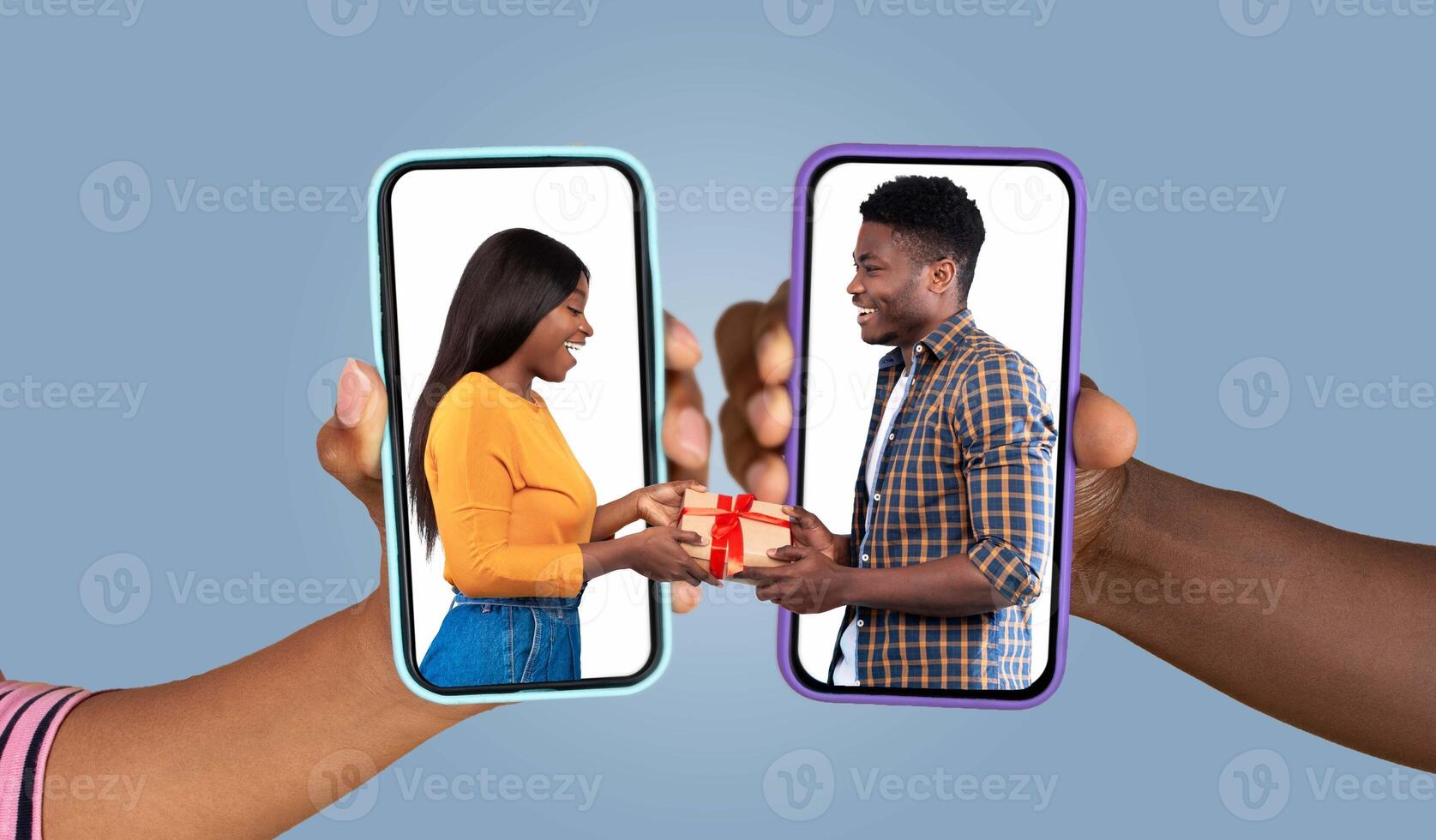 A couple joyfully interacts through smartphones, exchanging gifts. Their hands reach out, bridging distance with love and technology, capturing a modern way of connection. photo