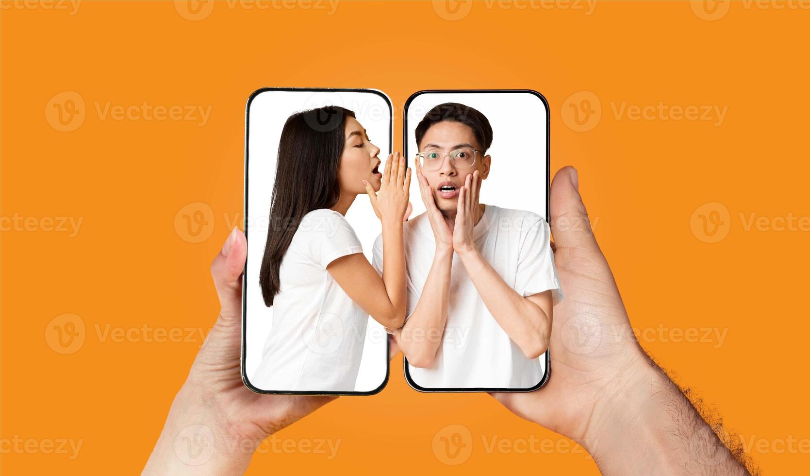A couple is seen engaging with each other through their smartphones. Each is using a messaging app to communicate while displaying excitement. photo