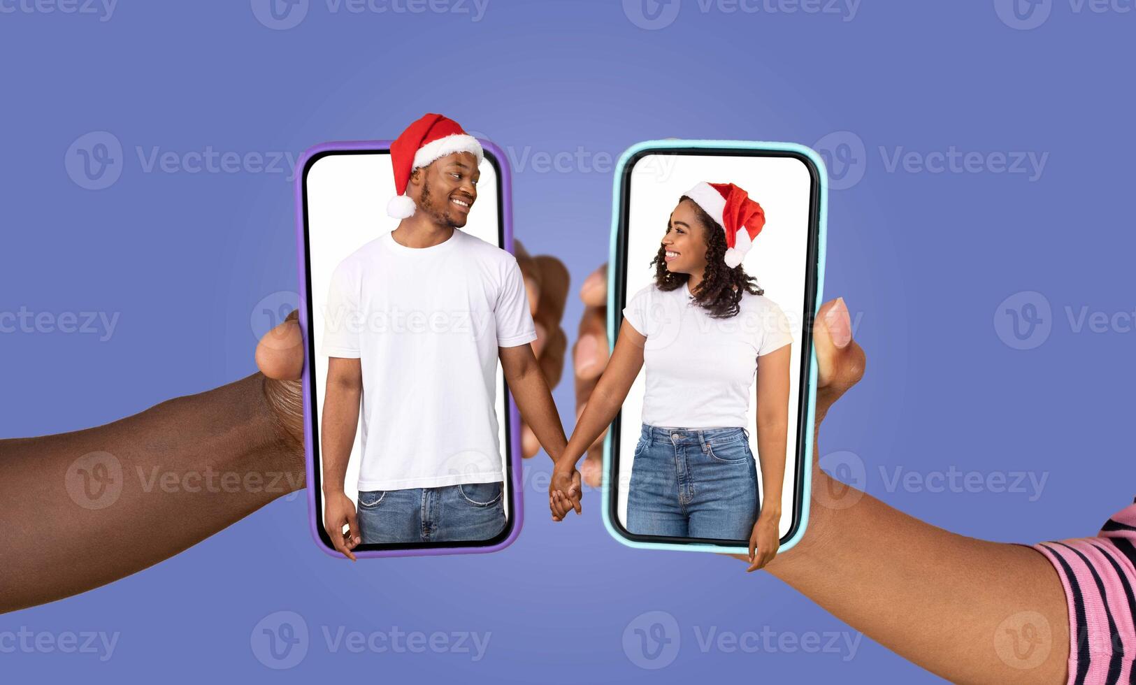 Two people, each holding a smartphone displaying the other, share a moment of love during a festive time. They are smiling and enjoying a conversation, connected despite distance. photo