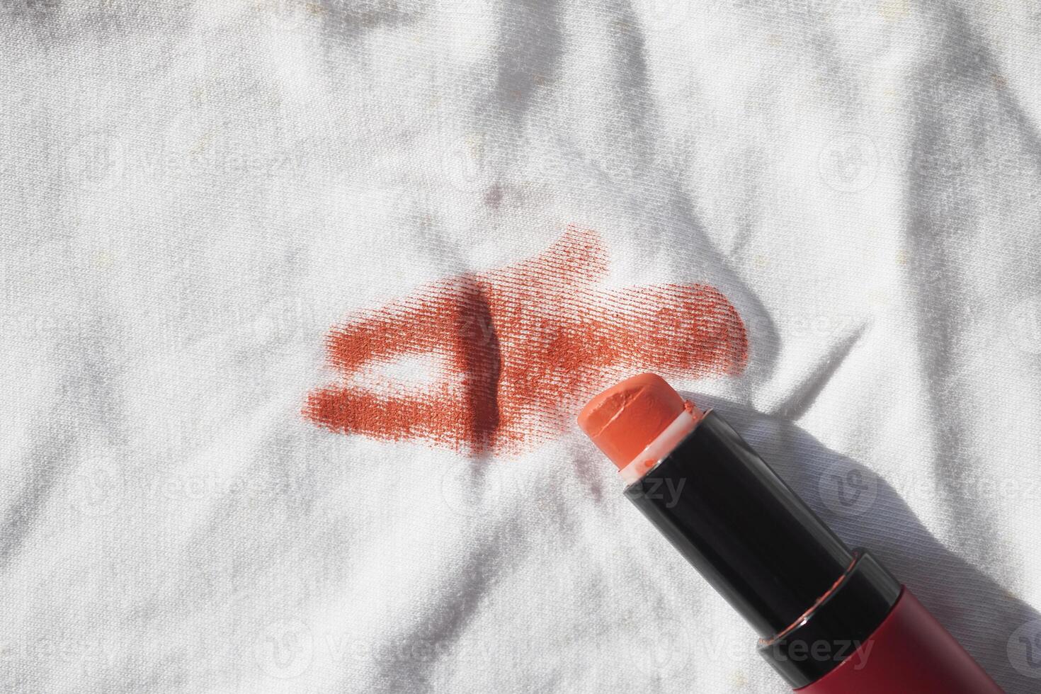 Lipstick stain on white shirt photo