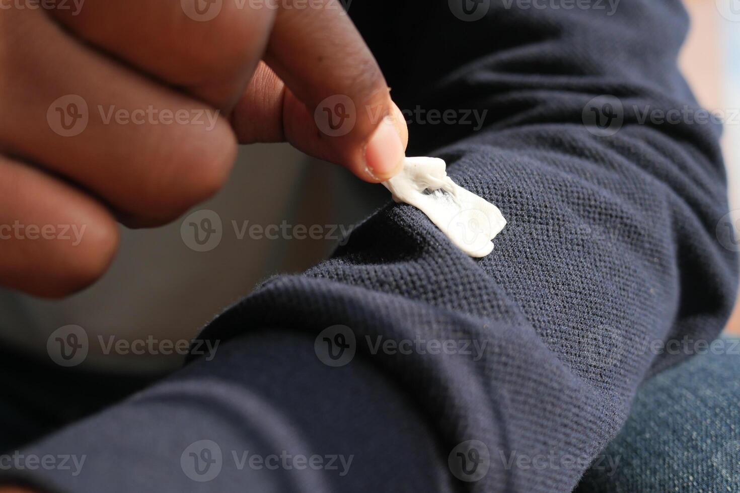 Detailed instructions for effectively removing chewing gum from fabric, with closeup view focus photo