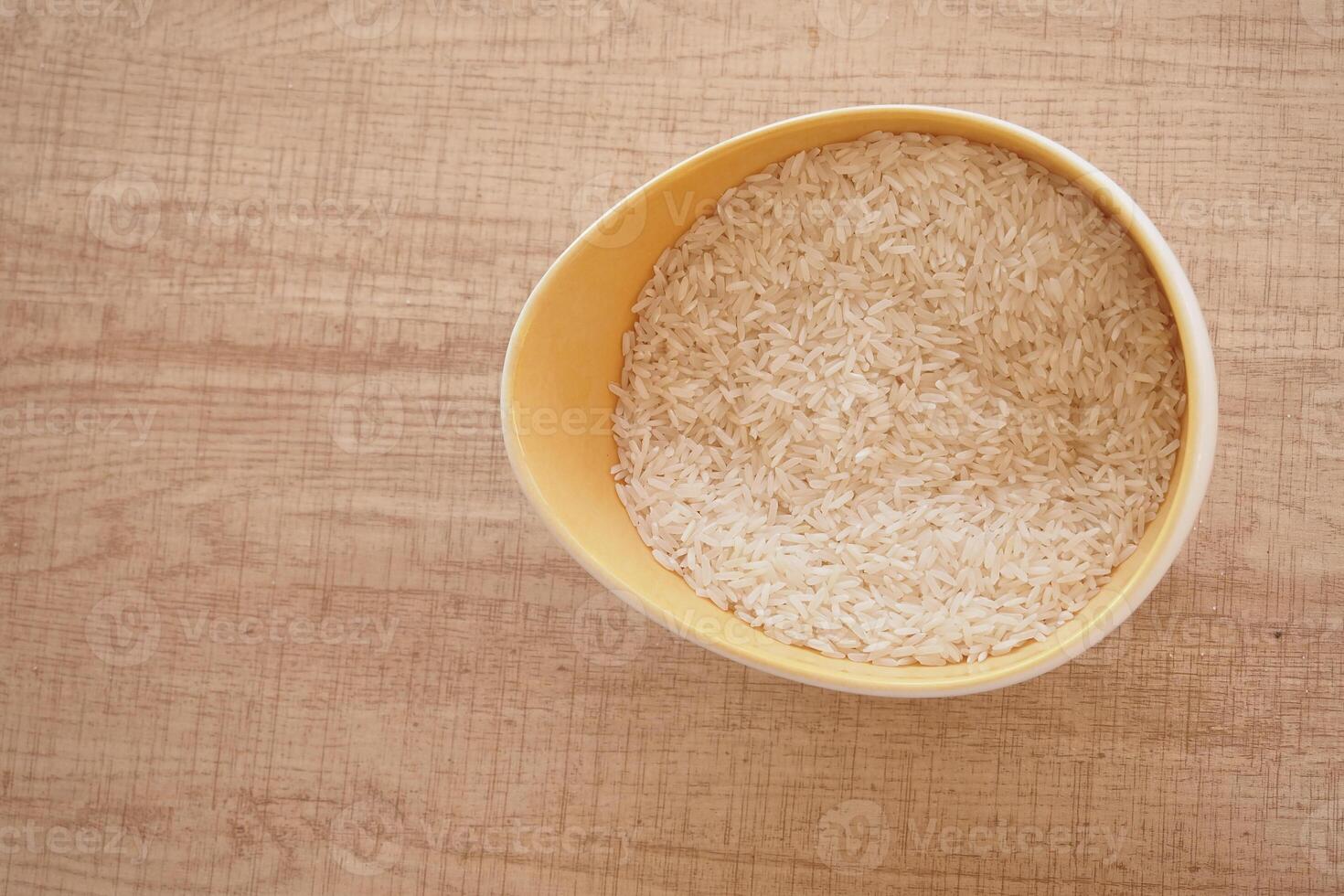 A CloseUp Image Showing White Rice Grains Neatly Arranged in a Pile photo