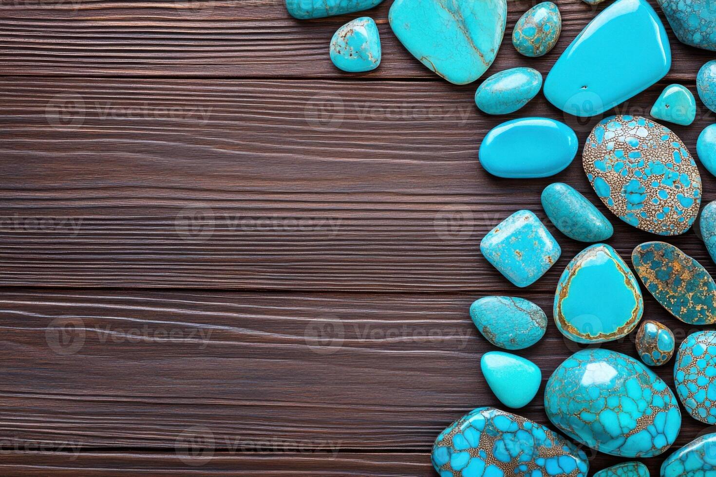 Artisanal turquoise jewelry displayed in a flat lay arrangement on a dark brown wooden surface with coral accents photo
