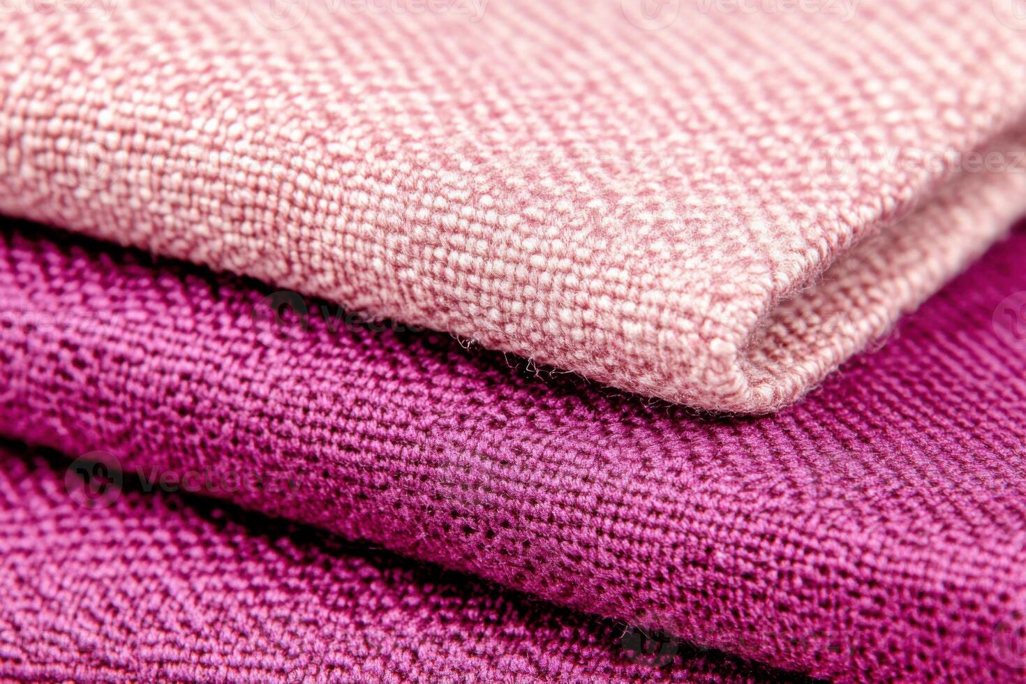 Close-up view of textured velvet fabric in dusty rose and deep purple tones showcasing luxury and coziness photo