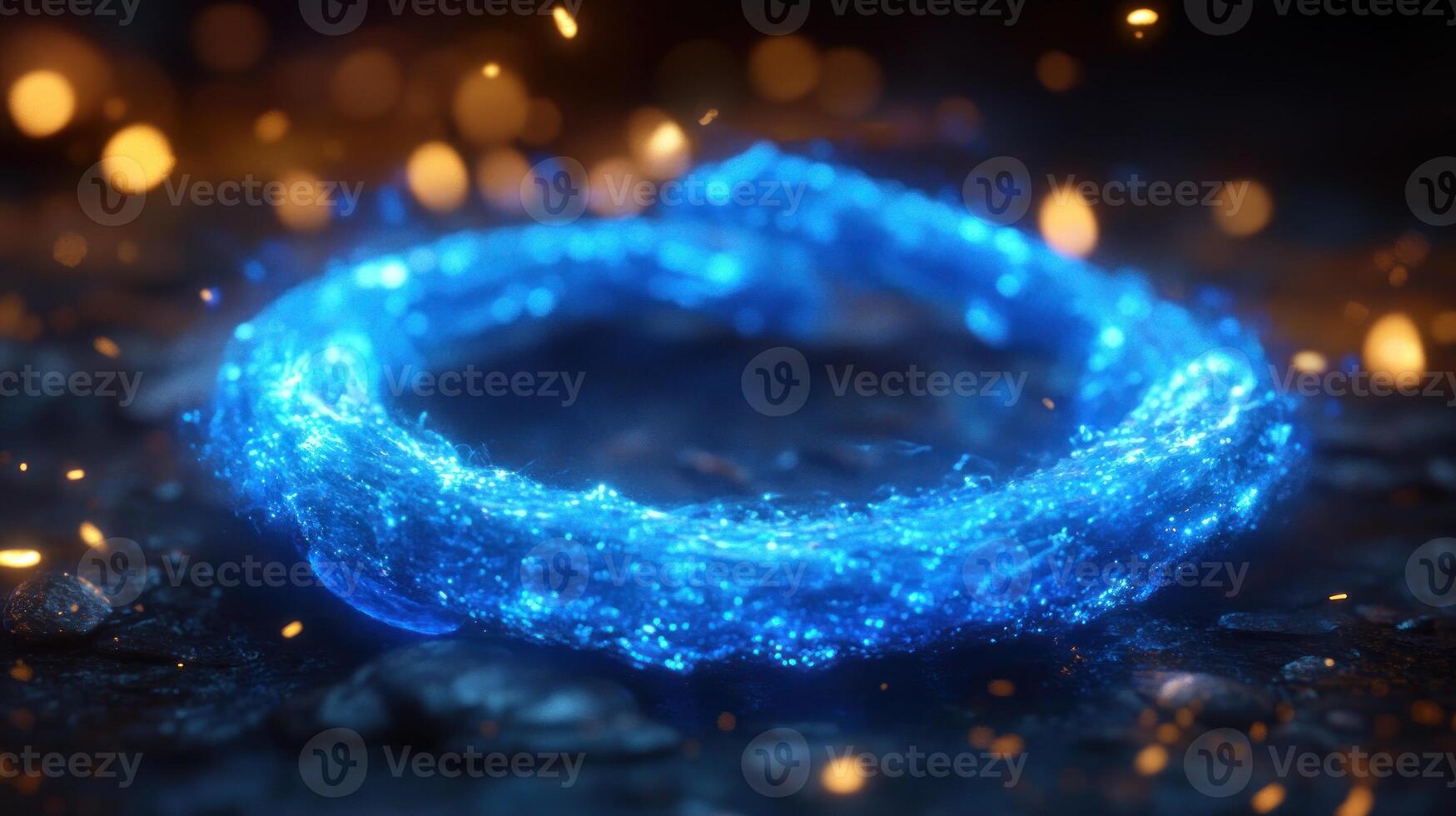 A bright blue energy ring radiates light surrounded by twinkling sparks in a dark setting photo