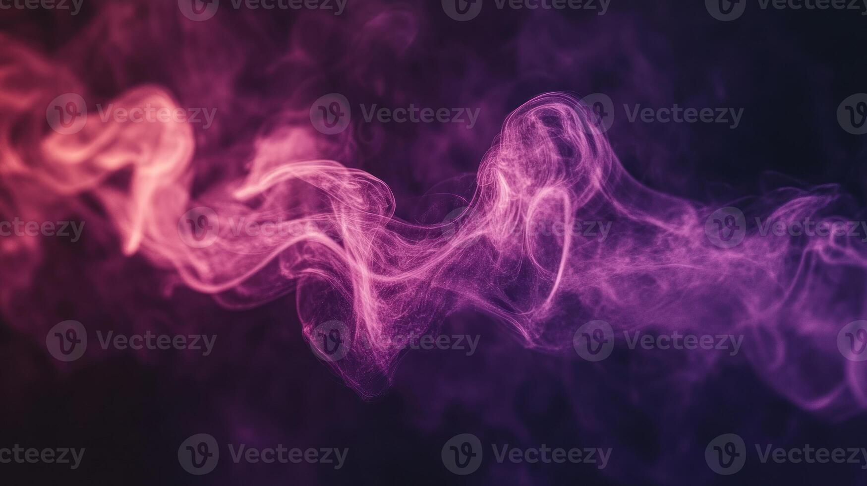 Flowing smoke in vivid pink and purple hues dances against the darkness, creating an enchanting visual effect photo
