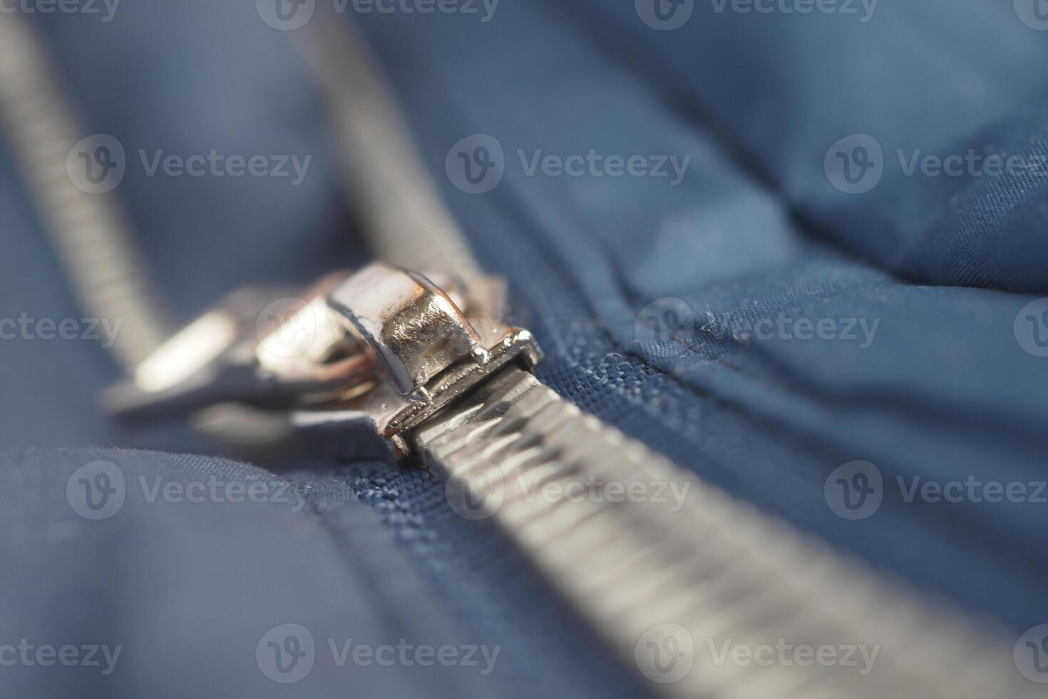 Close-up of a zipper with a slider photo