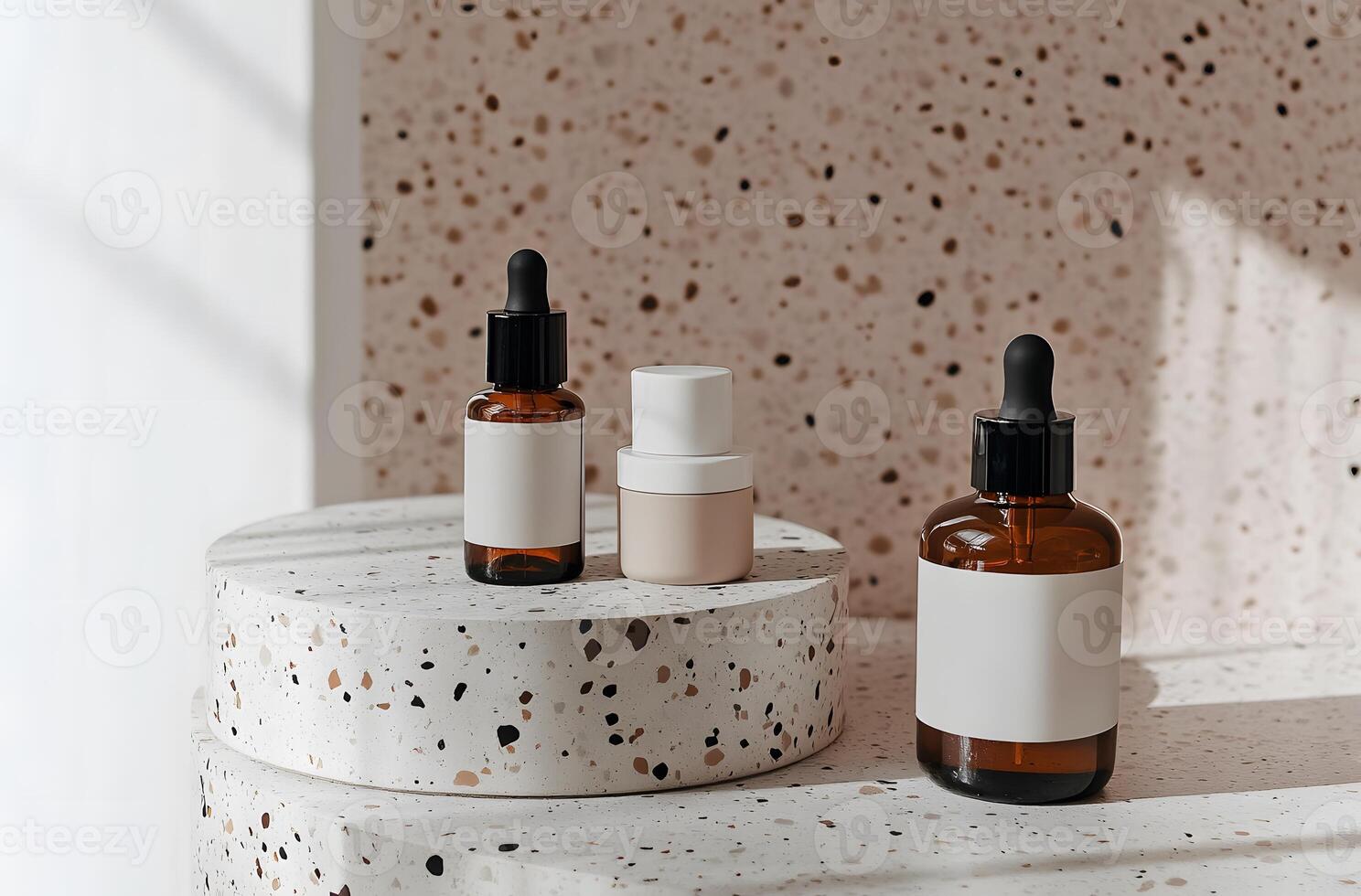 Three Amber Bottles with Dropper Tops on a White and Brown Terrazzo Surface photo