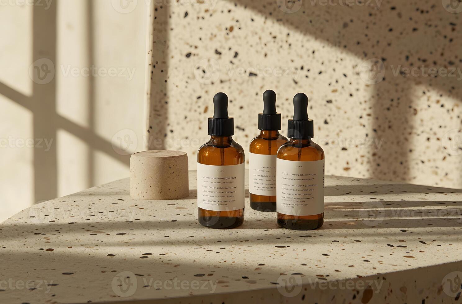 Three Glass Dropper Bottles on a Terrazzo Surface photo