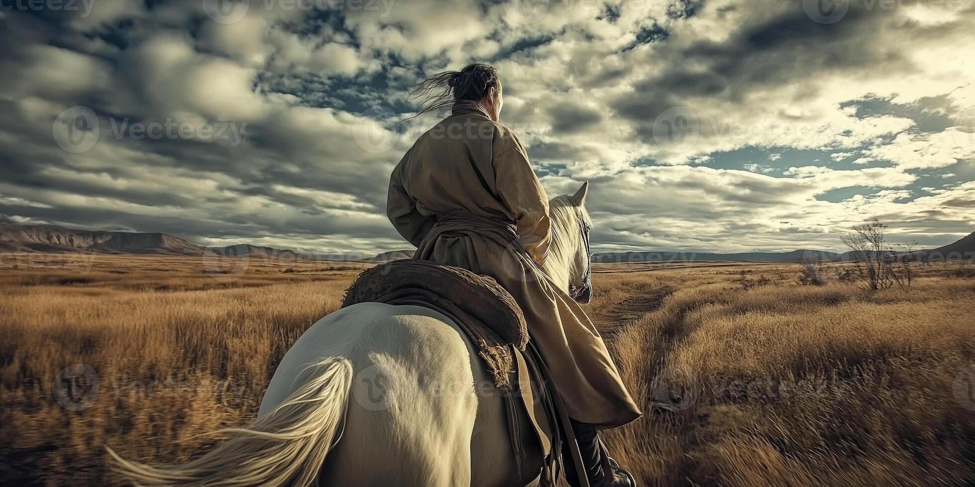 Rider on horseback traversing vast plains photo