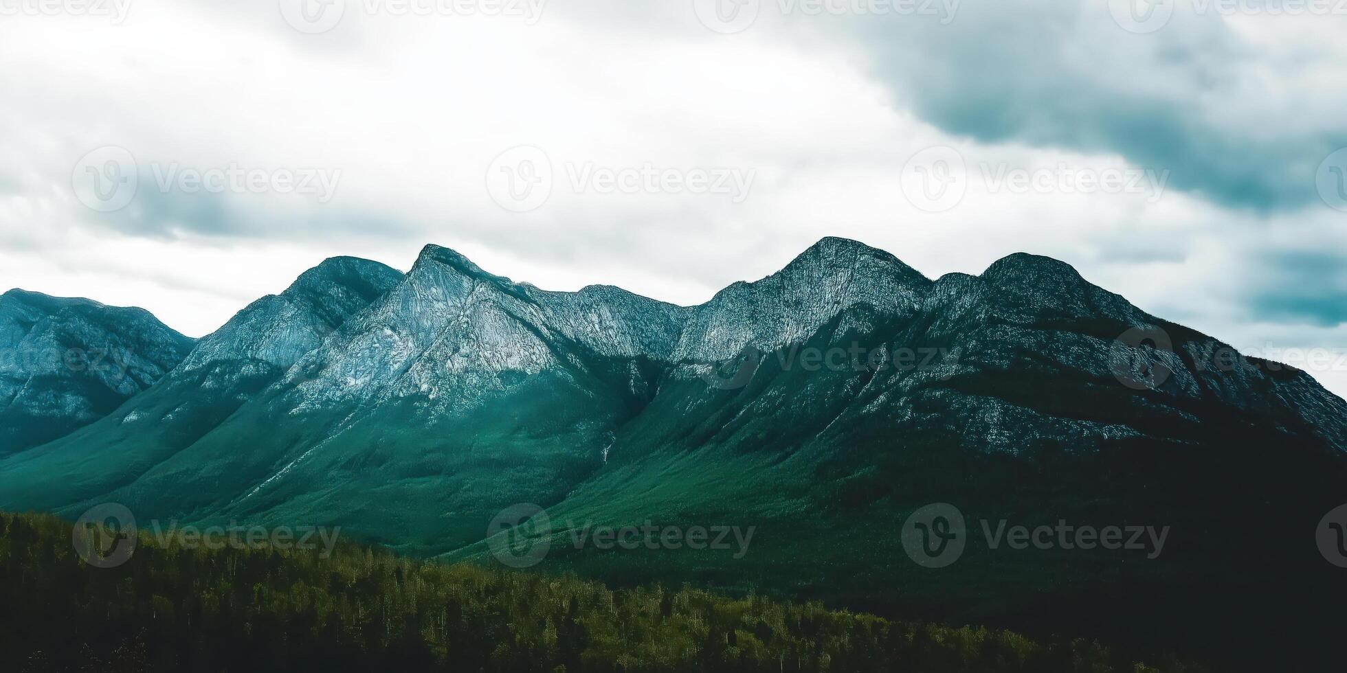 Majestic mountains under a cloudy sky photo