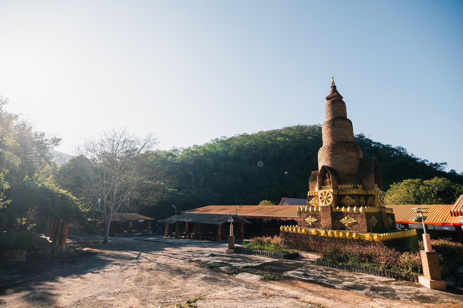 Beautiful Ancient Temple Surrounded by Lush Greenery and Clear Sky photo