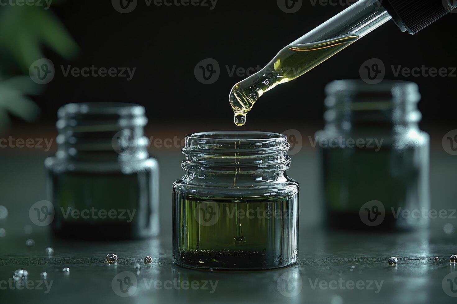 Pipette pouring green liquid into small glass jar for beauty products or medical use photo