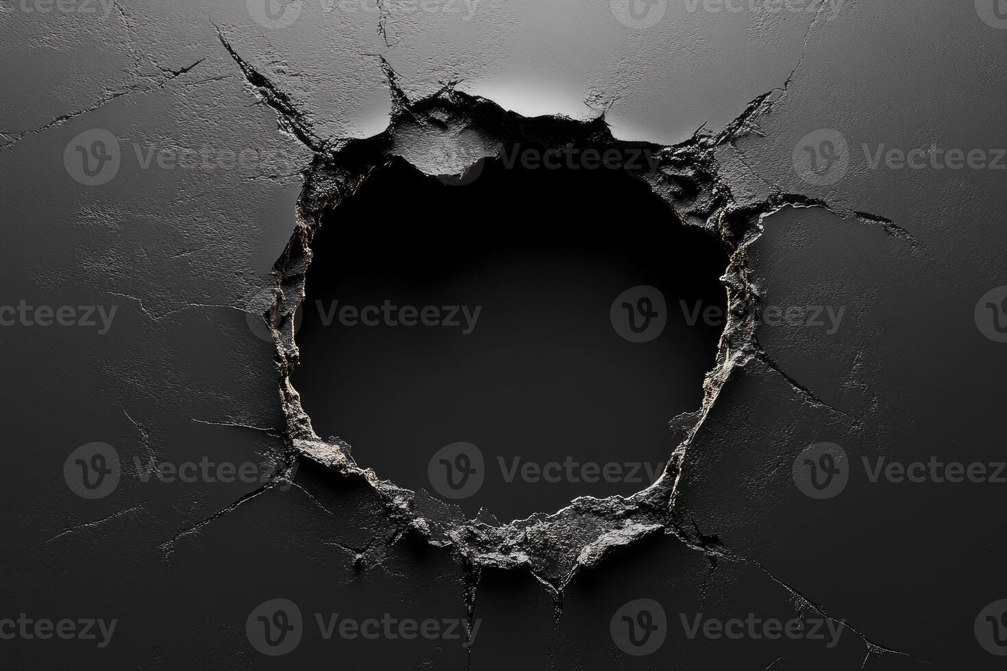 Broken black wall creating a circular hole revealing darkness photo
