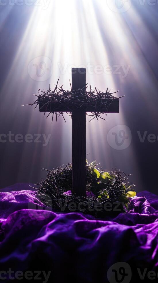 Crown of thorns on wooden cross with purple cloth and light rays symbolizing jesus christ's sacrifice photo
